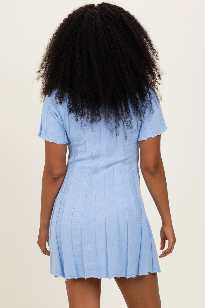 woman wearing a light blue ribbed knit short sleeve dress with a slightly flared hem and back view visible