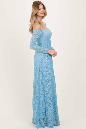woman wearing a light blue off-the-shoulder lace maxi dress with long sleeves