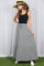 woman wearing a black tank top and a gray striped maxi skirt with tiers and a drawstring waist
