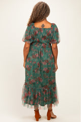 woman wearing a green floral plus size maxi dress with puff sleeves and ruffle hem, viewed from the back