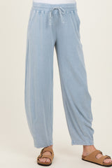 woman wearing light blue maternity lounge pants with an elastic waistband and side pockets