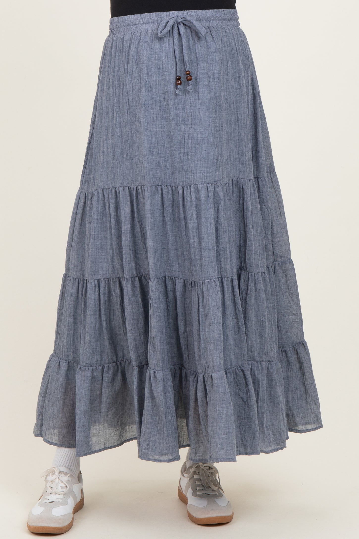 maternity wear grey tiered maxi skirt with drawstring waist and model wearing sneakers
