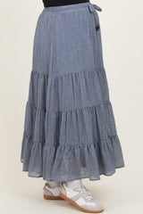 maternity wear blue tiered maxi skirt with ruffle hem details and a drawstring waistband, paired with sneakers