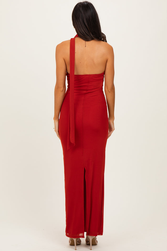 woman wearing a red satin maxi dress with a one-shoulder design and a thigh-high slit at the back