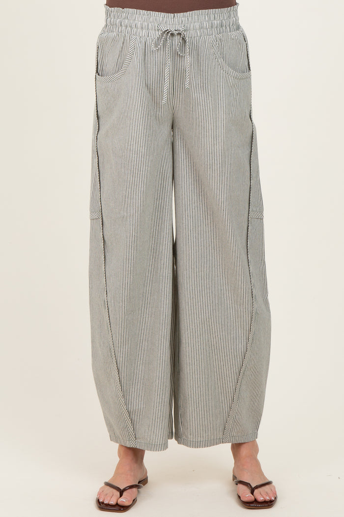 woman wearing striped wide-leg maternity pants with an elastic waistband and side pockets