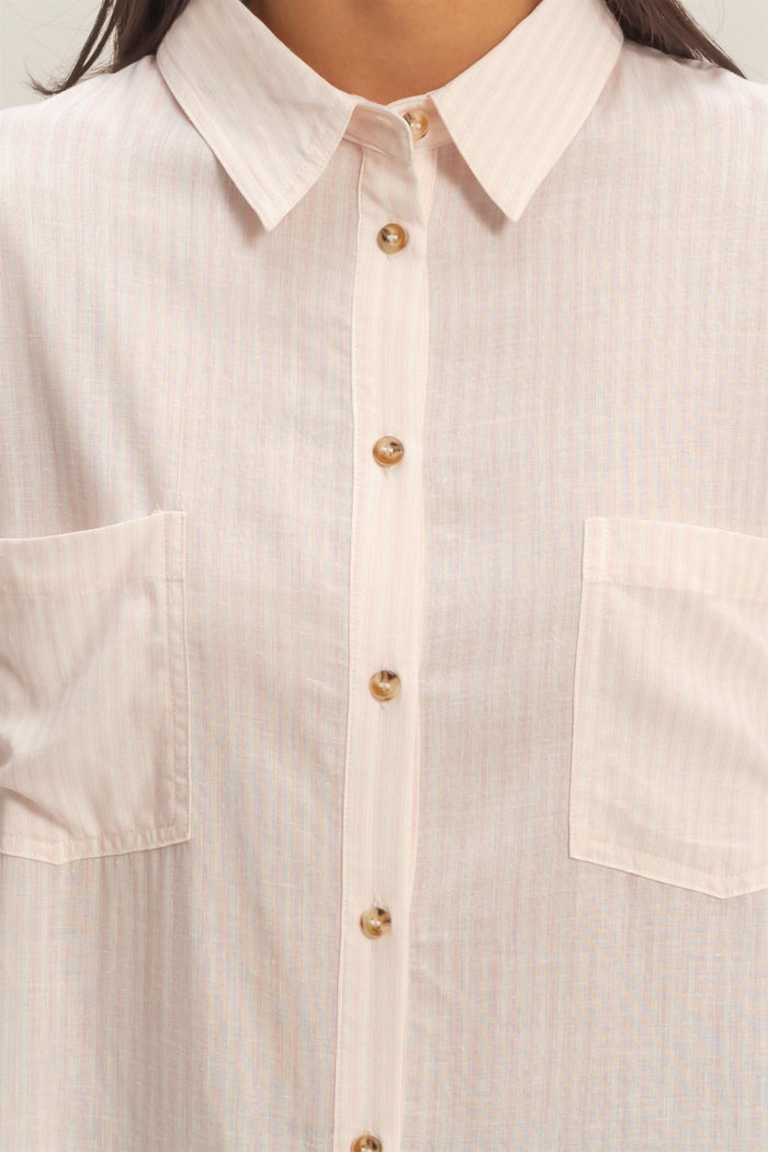 light pink button-up shirt with vertical stripes and two chest pockets