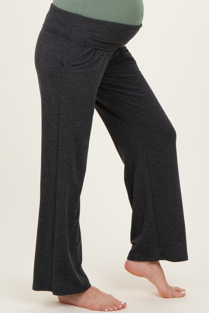 maternity wear in dark gray wide-leg pants with a comfortable waistband and highlighted baby bump