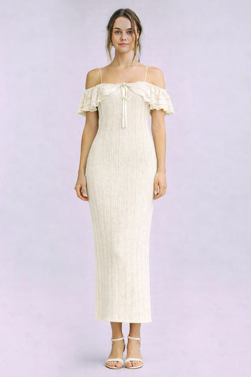 woman wearing a cream off-the-shoulder ribbed midi dress with ruffled sleeves and a tie detail