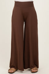 brown maternity wide-leg pants with a smocked waistband and side pockets
