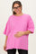 woman wearing a bright pink oversized maternity t-shirt and holding her baby bump