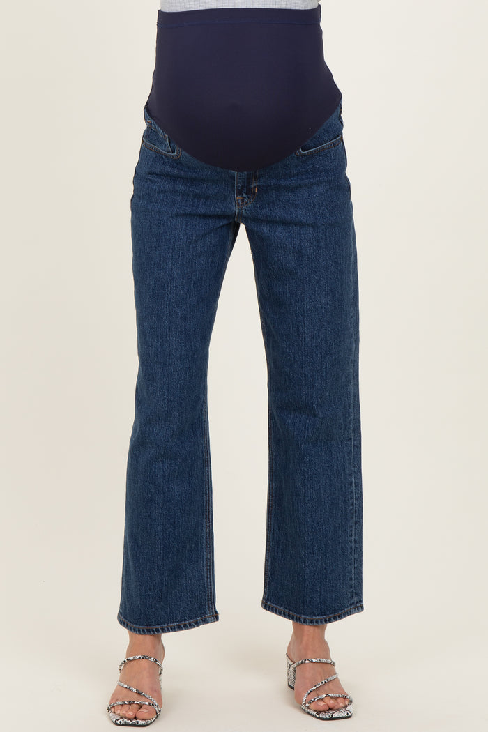 maternity wear dark blue straight leg jeans with a stretchy over-the-bump panel, model wearing high-heeled sandals