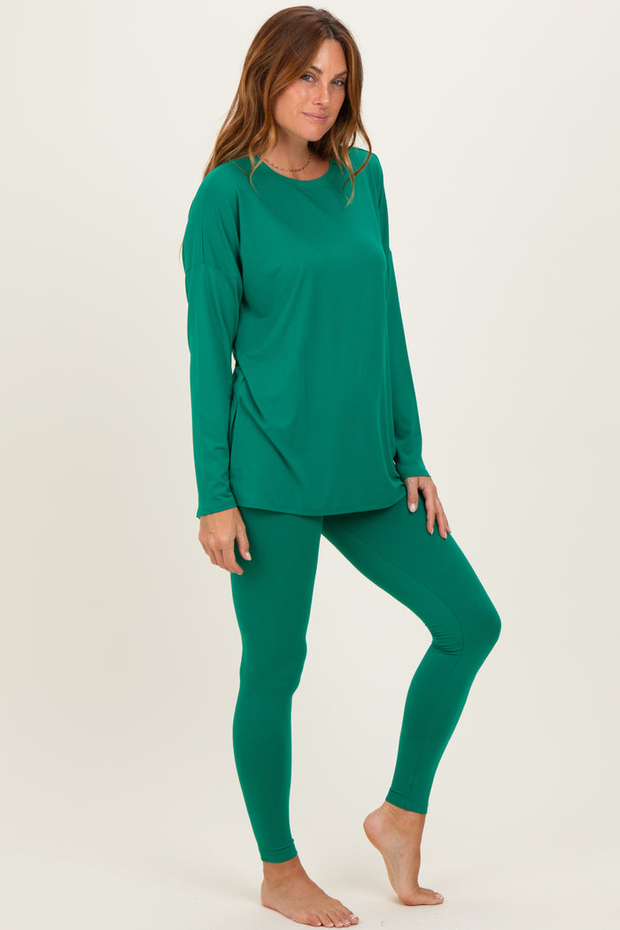 woman wearing a green long sleeve top and matching leggings