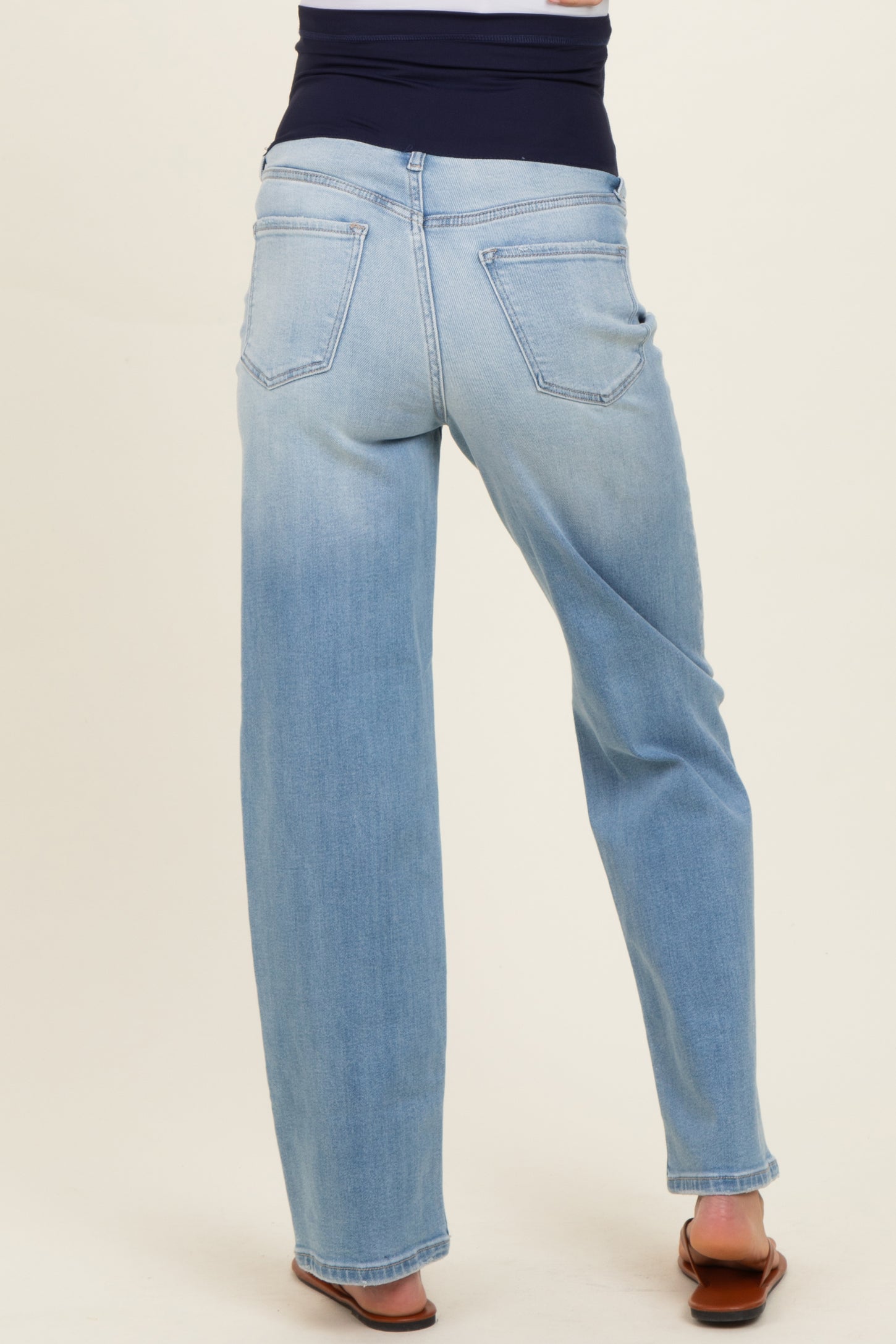 maternity wear light blue wide-leg jeans with a stretchy waistband, shown from the back