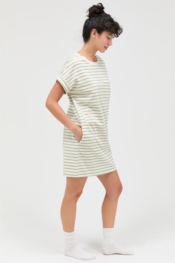 woman wearing a striped short sleeve dress with pockets in a relaxed fit and knee-length style