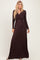 woman wearing a dark burgundy long sleeve maxi dress with a deep v-neck and wrap detail