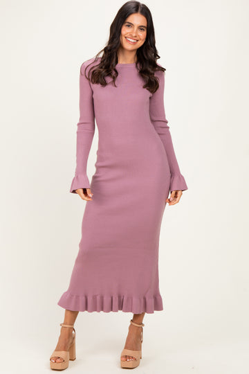 woman wearing a dusty mauve long sleeve ribbed knit maxi dress with ruffle hem and flared sleeves