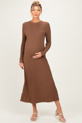 woman wearing a brown ribbed long sleeve maternity dress, showcasing her baby bump