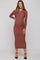 woman wearing a rust long sleeve ribbed maternity dress and showing her baby bump