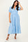 woman wearing a light blue puff sleeve maxi dress with a tiered skirt and v-neckline
