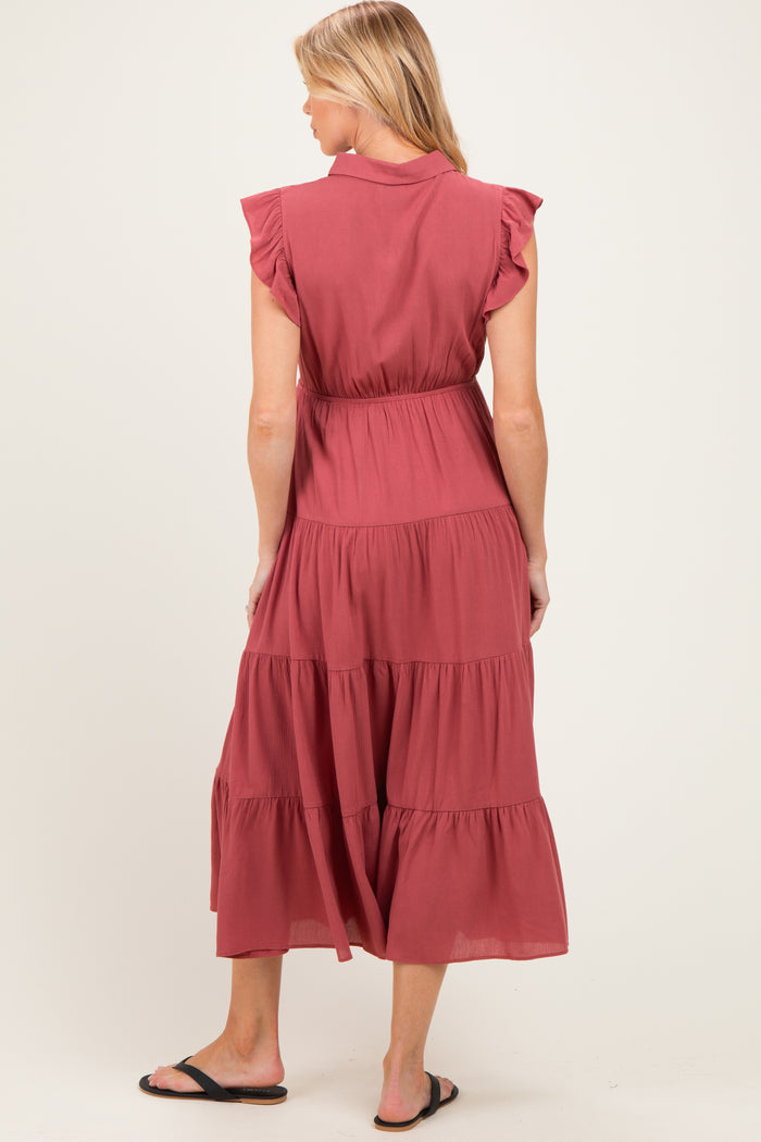 woman wearing a dusty rose maternity dress with ruffle sleeves and tiered design, showing a baby bump from the back