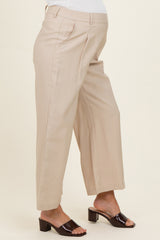 maternity wear beige wide leg pants with a high waist, styled with black heeled sandals and a fitted top