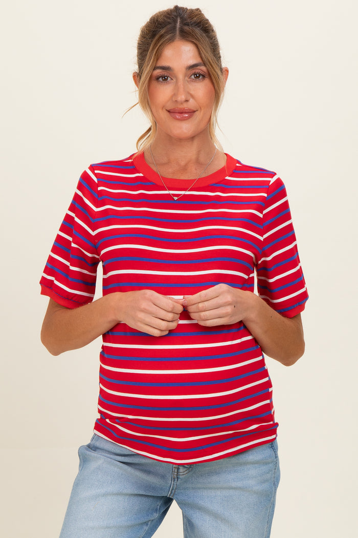 woman wearing a red and blue striped maternity top with short sleeves and a visible baby bump