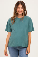 woman wearing a teal short sleeve maternity t-shirt that fits over her baby bump