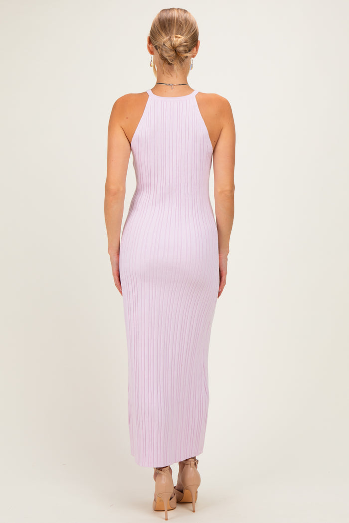 woman wearing a light lavender ribbed sleeveless maxi dress, showing the back view