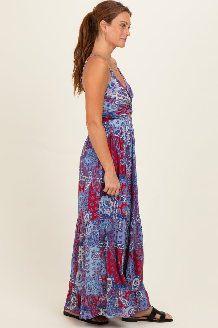 woman wearing a purple and red patterned maxi dress with a v-neckline and adjustable straps