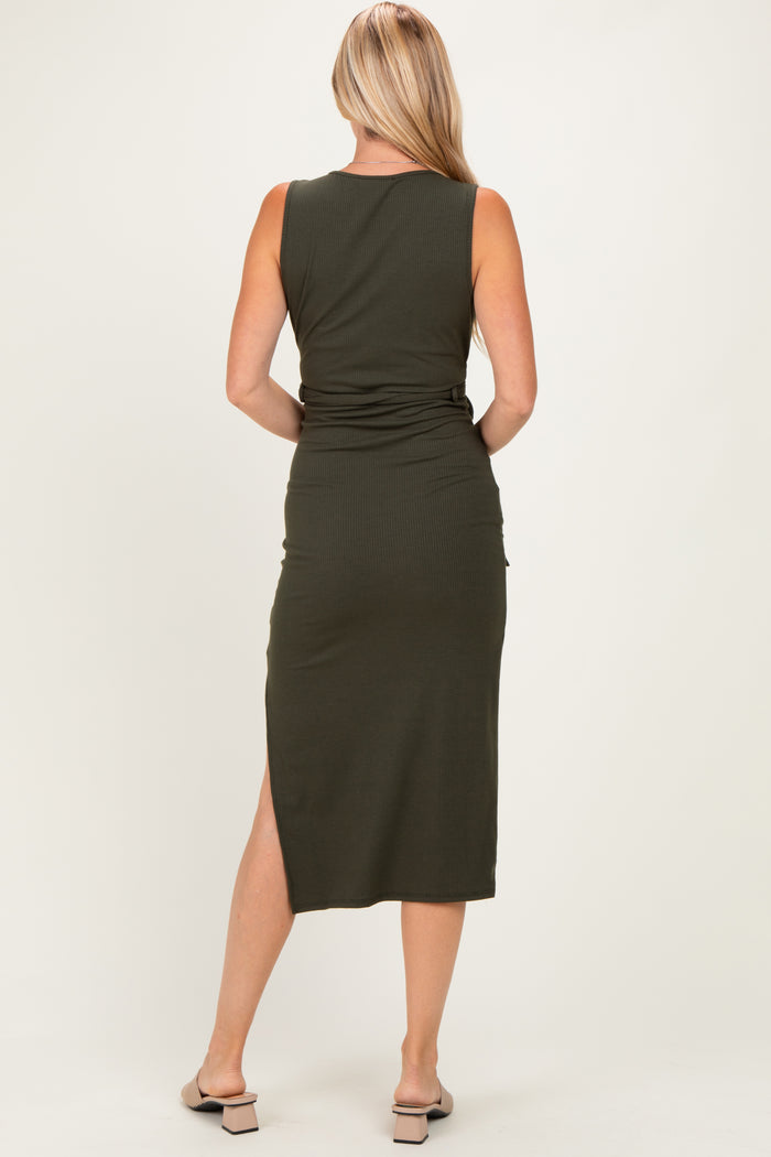 woman wearing a fitted olive green midi dress with a side slit and a sleek design, seen from the back