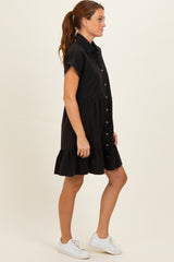 woman wearing a black short sleeve shirt dress with a button front and ruffle hem, styled with white sneakers