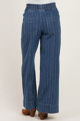 woman wearing maternity striped denim wide-leg pants, showing the back view with elastic waistband and two back pockets