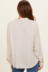 light beige long sleeve button-up shirt with subtle stripes, shown from the back