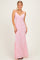 woman wearing a pink floral print maxi dress with a fitted silhouette and spaghetti straps