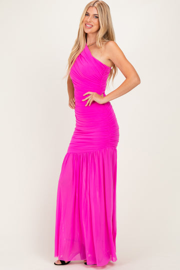 woman wearing a bright pink one-shoulder evening gown with ruching and a flowing skirt