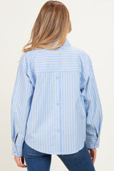 woman wearing a blue striped maternity shirt with long sleeves and a relaxed fit, shown from the back