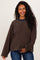 woman wearing a brown striped maternity sweatshirt with a navy collar and holding her baby bump