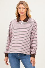 woman wearing a pink and brown striped maternity polo sweatshirt with a collar and long sleeves