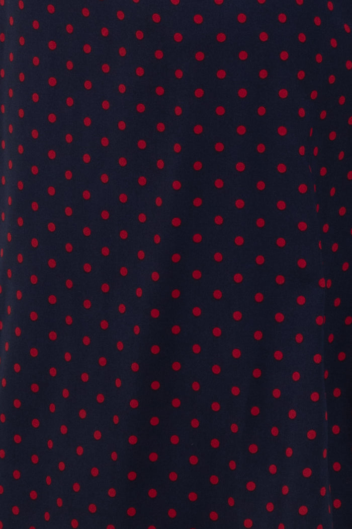 navy blue fabric with red polka dots pattern