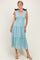 woman wearing a blue plaid midi dress with tie straps and a tiered skirt