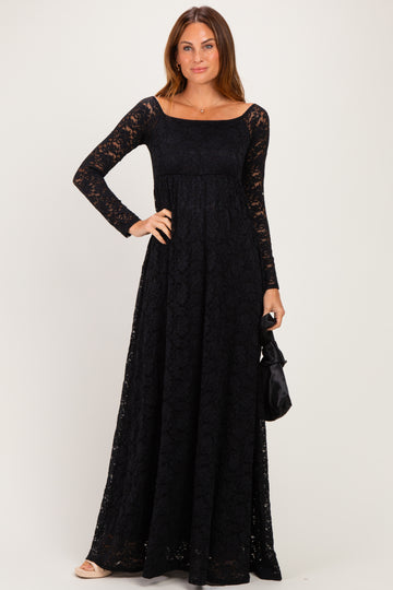 woman wearing a black lace long sleeve maxi dress with a square neckline and a fitted bodice