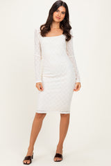 woman wearing a white lace long sleeve bodycon dress with a square neckline and fitted silhouette