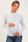 woman wearing a light blue and white striped maternity top with a baby bump visible