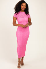 woman wearing a fitted hot pink lace midi dress with short sleeves and a high neckline