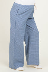 maternity wear wide-leg pants in blue gingham pattern with a drawstring waist and side pockets, worn by a model with a baby bump