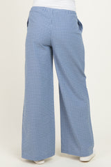 woman wearing blue checkered wide-leg maternity pants, viewed from the back