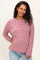 woman wearing a mauve striped maternity top with long sleeves and a relaxed fit