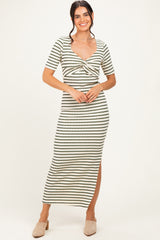 woman wearing a striped maxi dress with short sleeves and a knotted front detail, standing and smiling