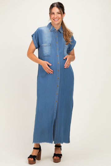 woman wearing a denim short sleeve maternity maxi dress, standing with hands on her baby bump
