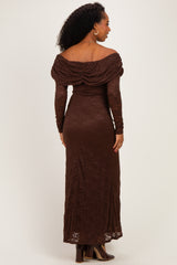 woman wearing a brown off-shoulder lace gown with long sleeves and a form-fitting silhouette, viewed from the back